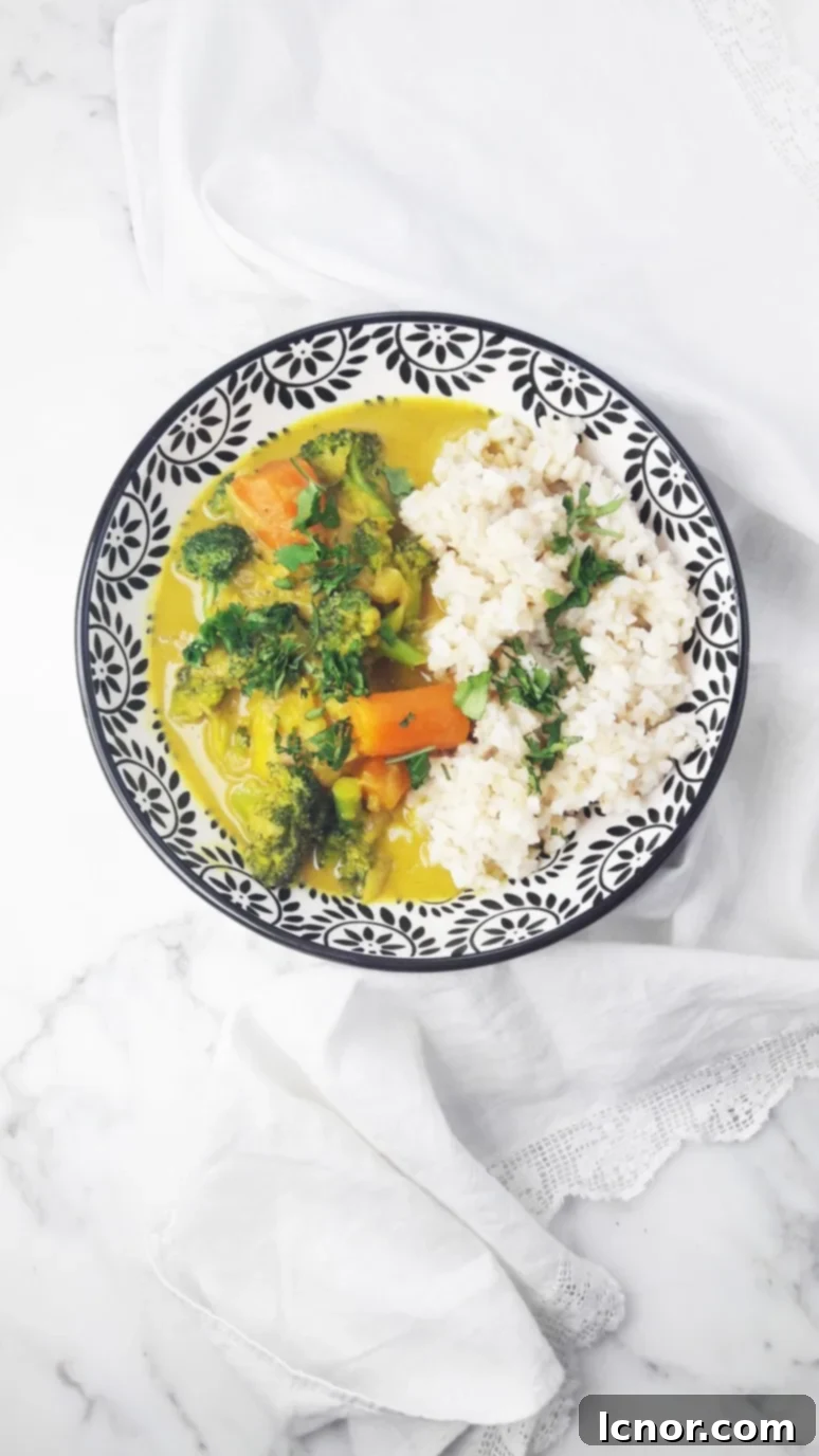 Vibrant broccoli carrot potato coconut curry served in a bowl, perfect for a light yet satisfying meal.