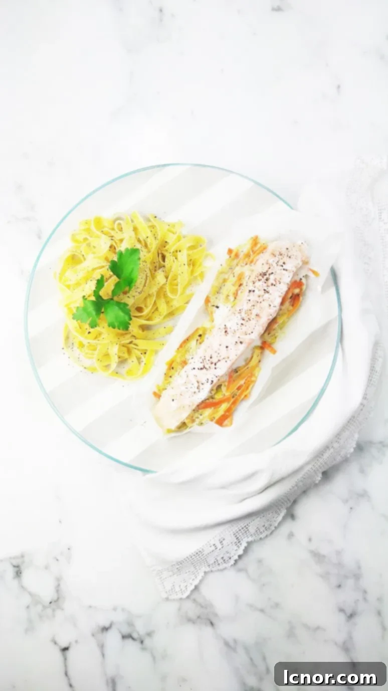 Juicy salmon, leeks, and carrots baked in parchment paper for an easy, healthy, and mess-free dinner.