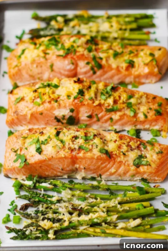 Garlic parmesan crusted salmon with fresh green asparagus spears.