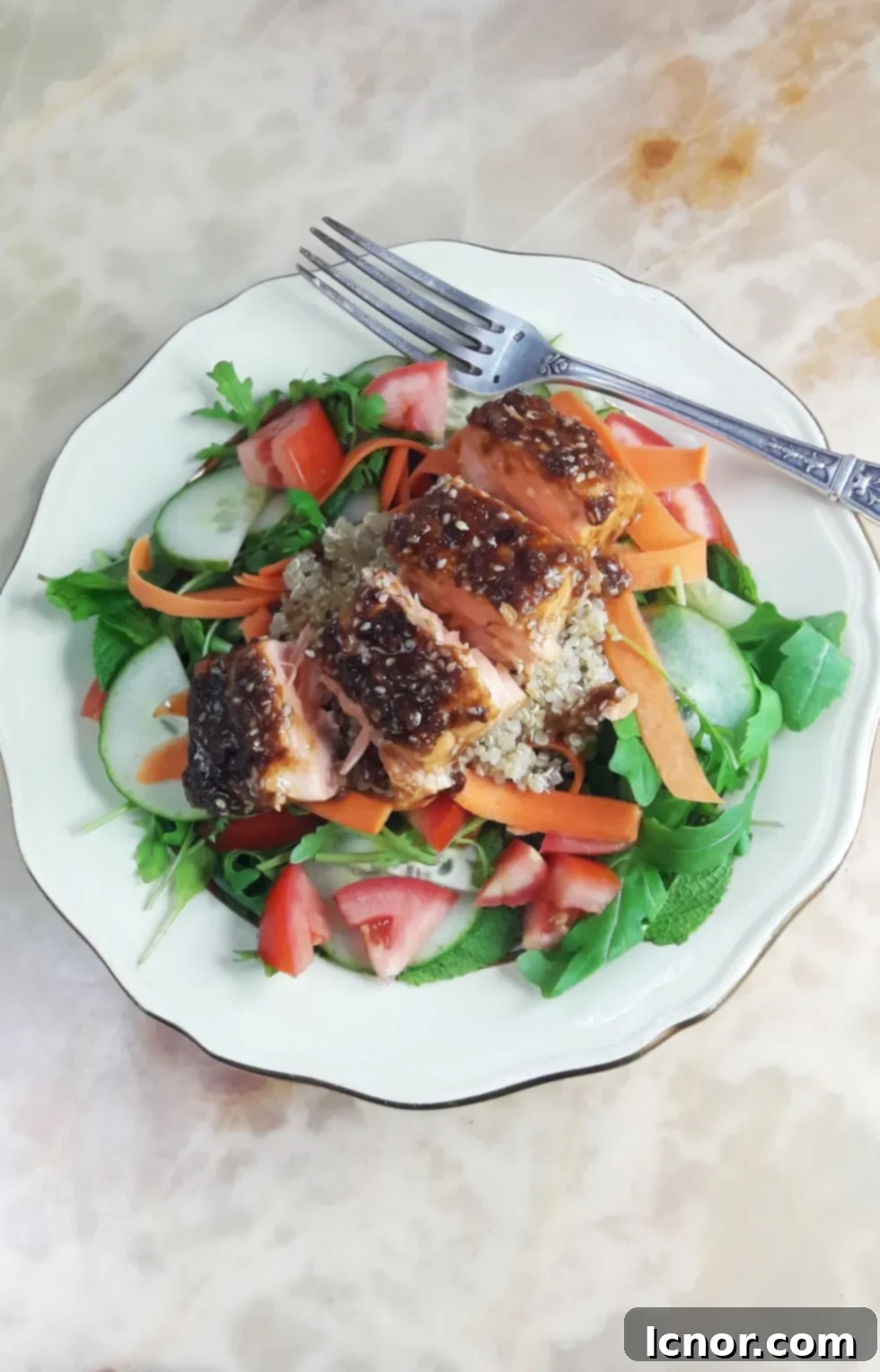 Fresh coriander mint salmon teriyaki summer salad with greens and a vibrant dressing.
