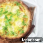 A slice of Goat Cheese Zucchini Quiche, perfect for an easy French meal.