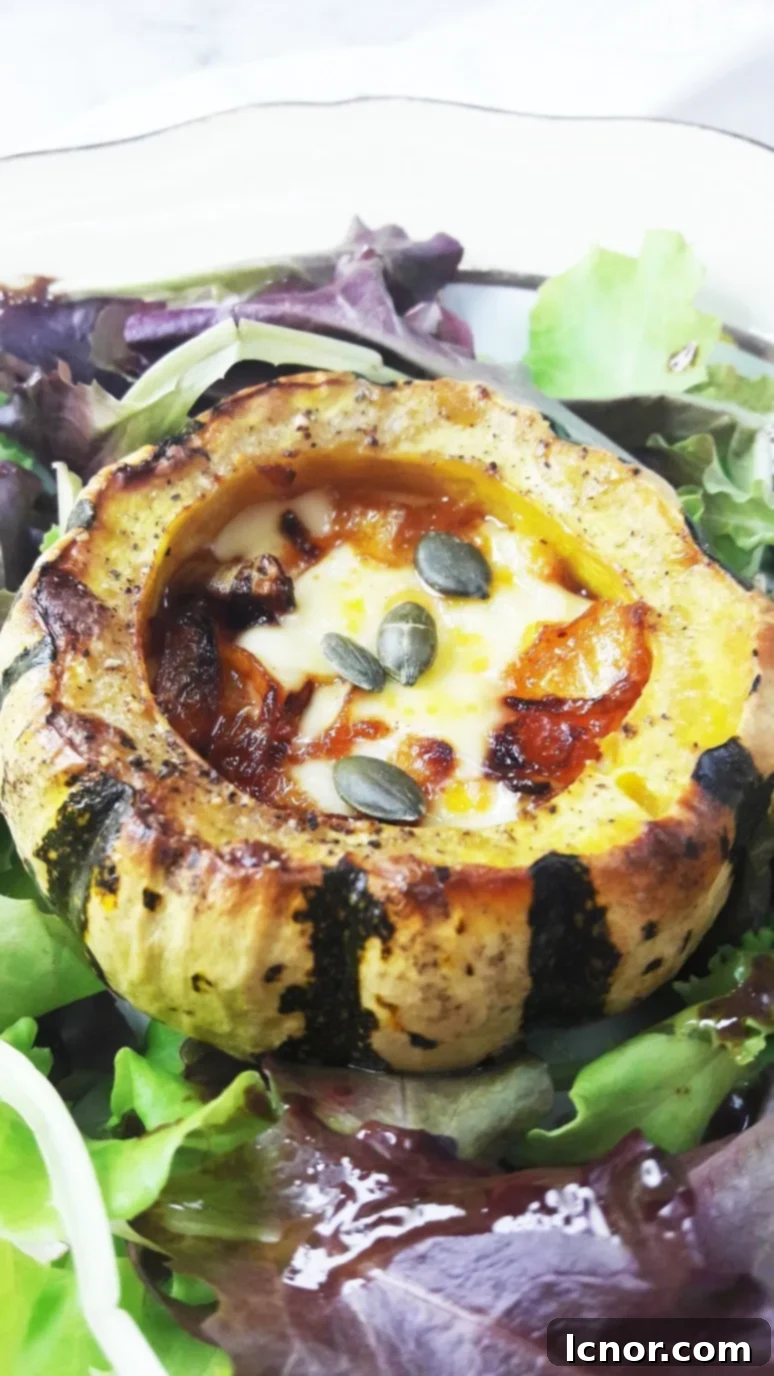 Sweet Dumpling Mini Squash baked with raclette cheese for a vegetarian Thanksgiving meal.