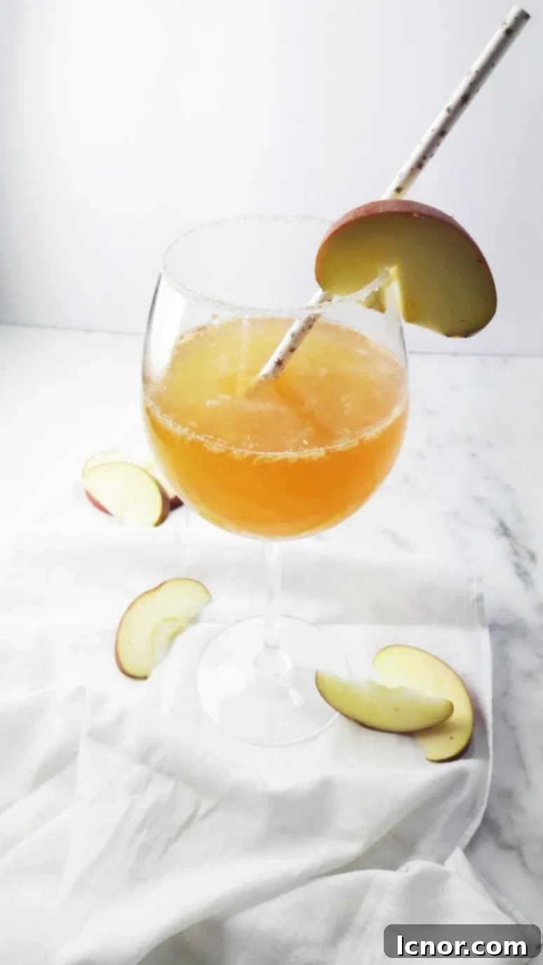 Lemon Ginger Infused Apple Cider Cocktail, a refreshing drink for Thanksgiving.