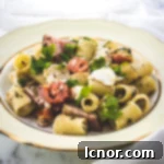 Flavorful fish pasta with cod, tuna pastrami and tomatoes