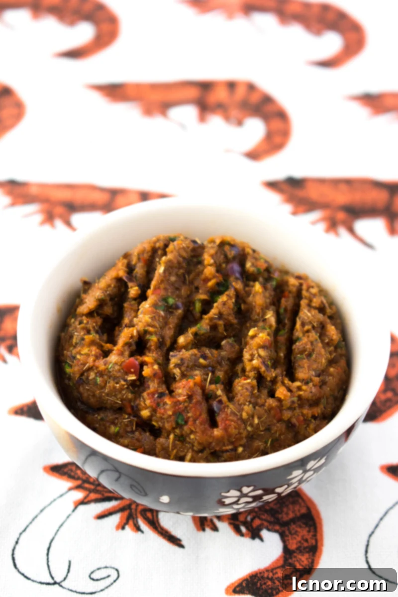 Vibrant homemade Thai Red Curry Paste, showcasing fresh ingredients and authentic Thai flavors.