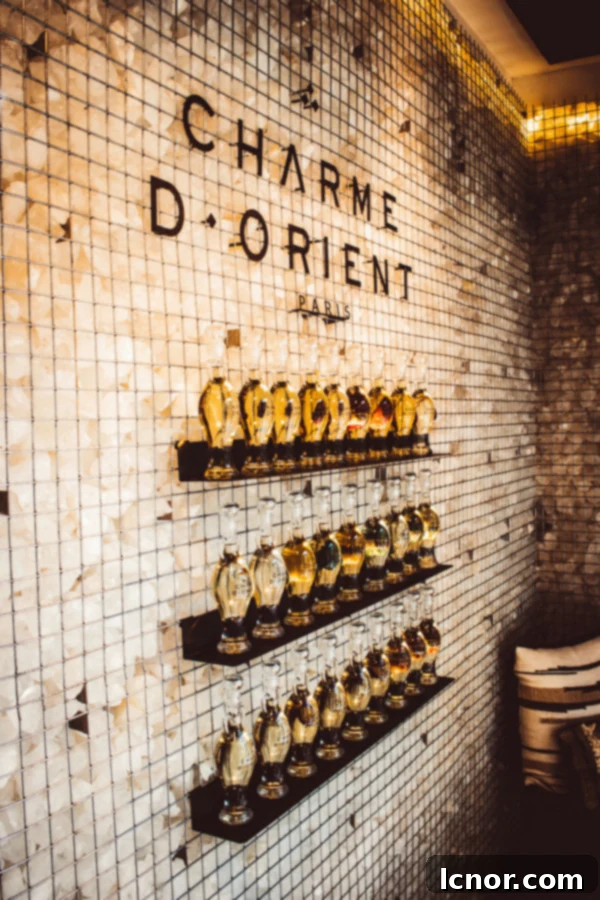 Essential oils selection at Charme d'Orient Spa, showcasing bottles inspired by the female form
