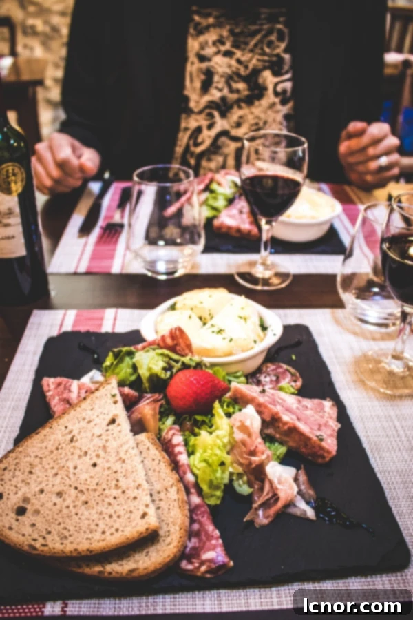 Delicious local cheese and meat platter at Les Remparts restaurant in Gerberoy