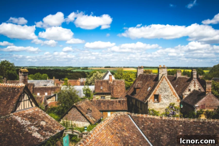 Panoramic view of Gerberoy's terracotta rooftops from an elevated viewpoint