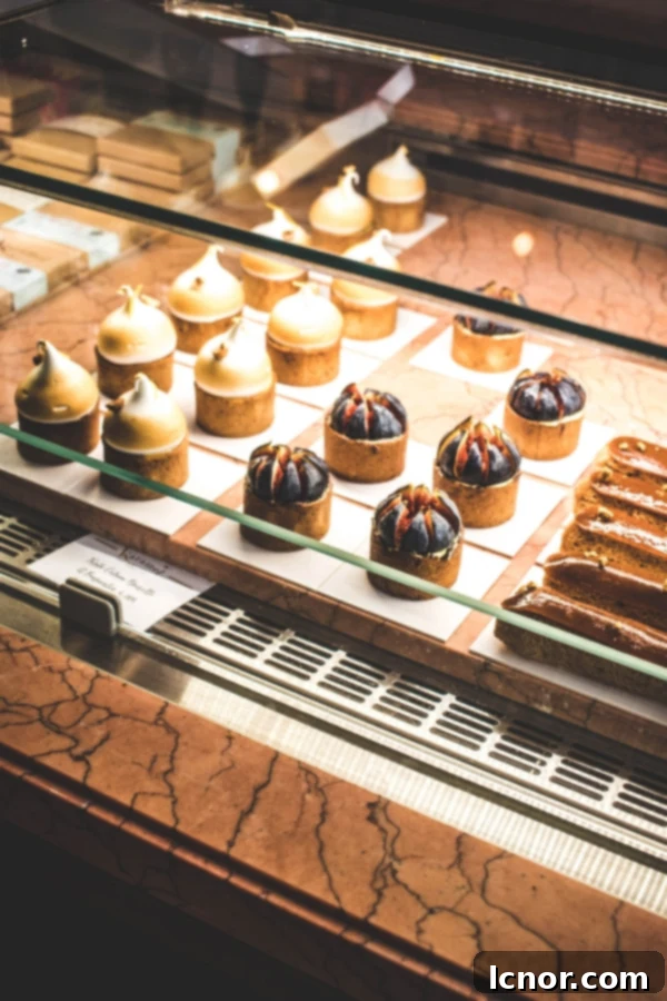 Interior view of Karamel Paris with pastry display