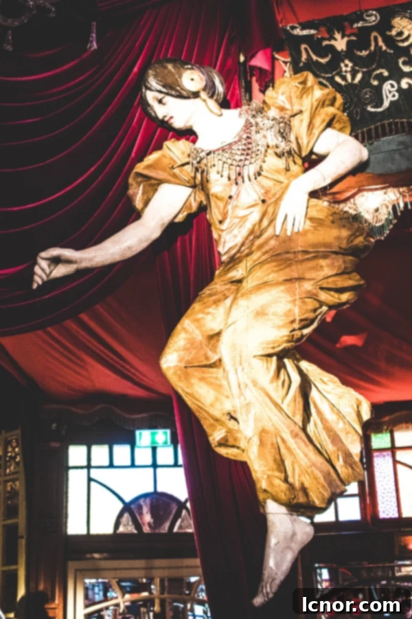 Intricately carved carousel horses and vintage fairground details at Musee des Arts Forains, showcasing historical artistry