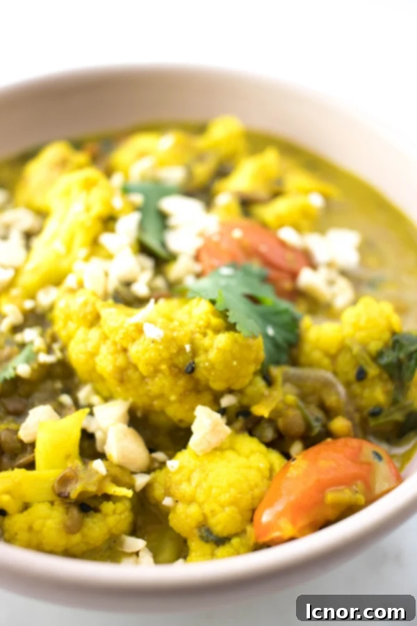 A bowl of creamy Kerala Cauliflower Curry, presented beautifully and ready to serve
