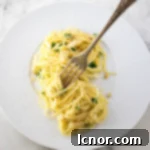 spaghetti with oil and garlic on a fork