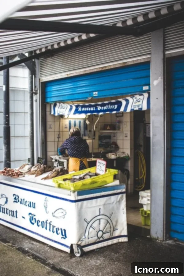 woman selling fish at the fish market in Northern France