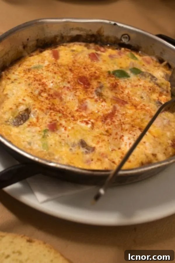 Athens food - Greek omelette with Suzuki (spicy sausage) & pastourma (cured veal meat).