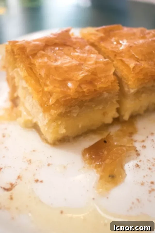 Galaktoboureko - one of the best Greek desserts filled with cream and topped with flaky phyllo pastry (Athens food)