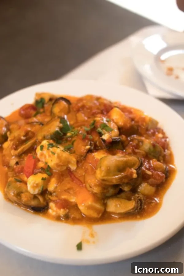 Mussels Saganaki - mussels, tomato sauce & feta is the perfect Athens food.