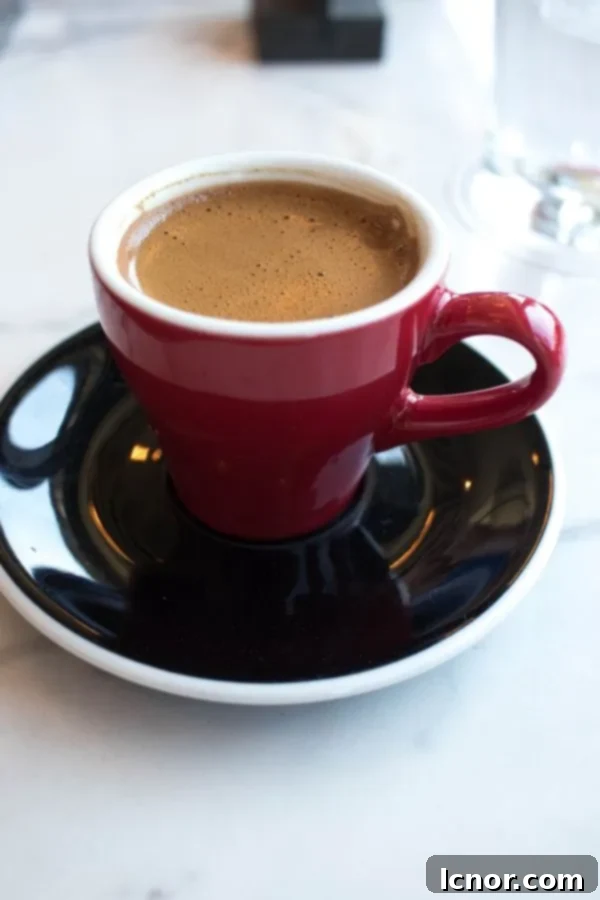 Greek coffee - a strong, unfiltered coffee in a small red espresso cup