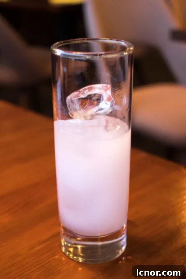 Greek ouzo in a large glass with ice.
