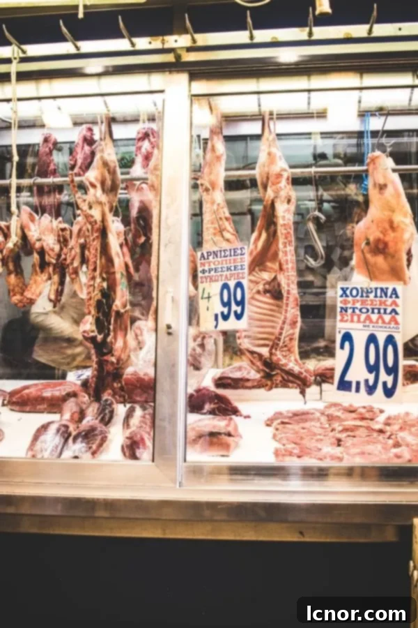 Athens Central Food Market: 10 Must-Visit Reasons 6 Various cuts of hanging meat at the Central Market in Athens Greece.