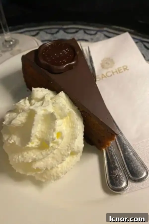 sacher torte and whipped cream at Hotel Sacher Vienna Austria